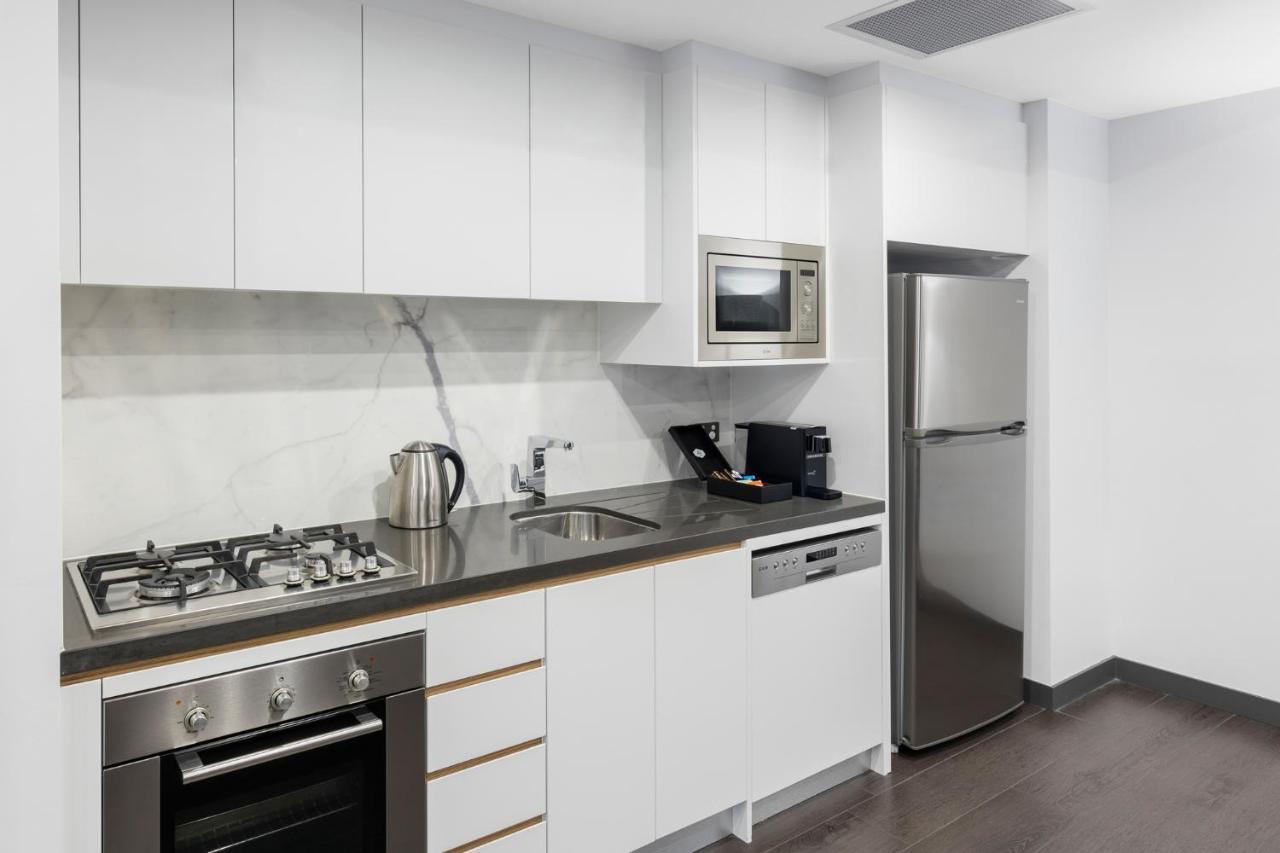 Meriton Suites Chatswood Sydney Exterior photo A typical kitchen in a student apartment